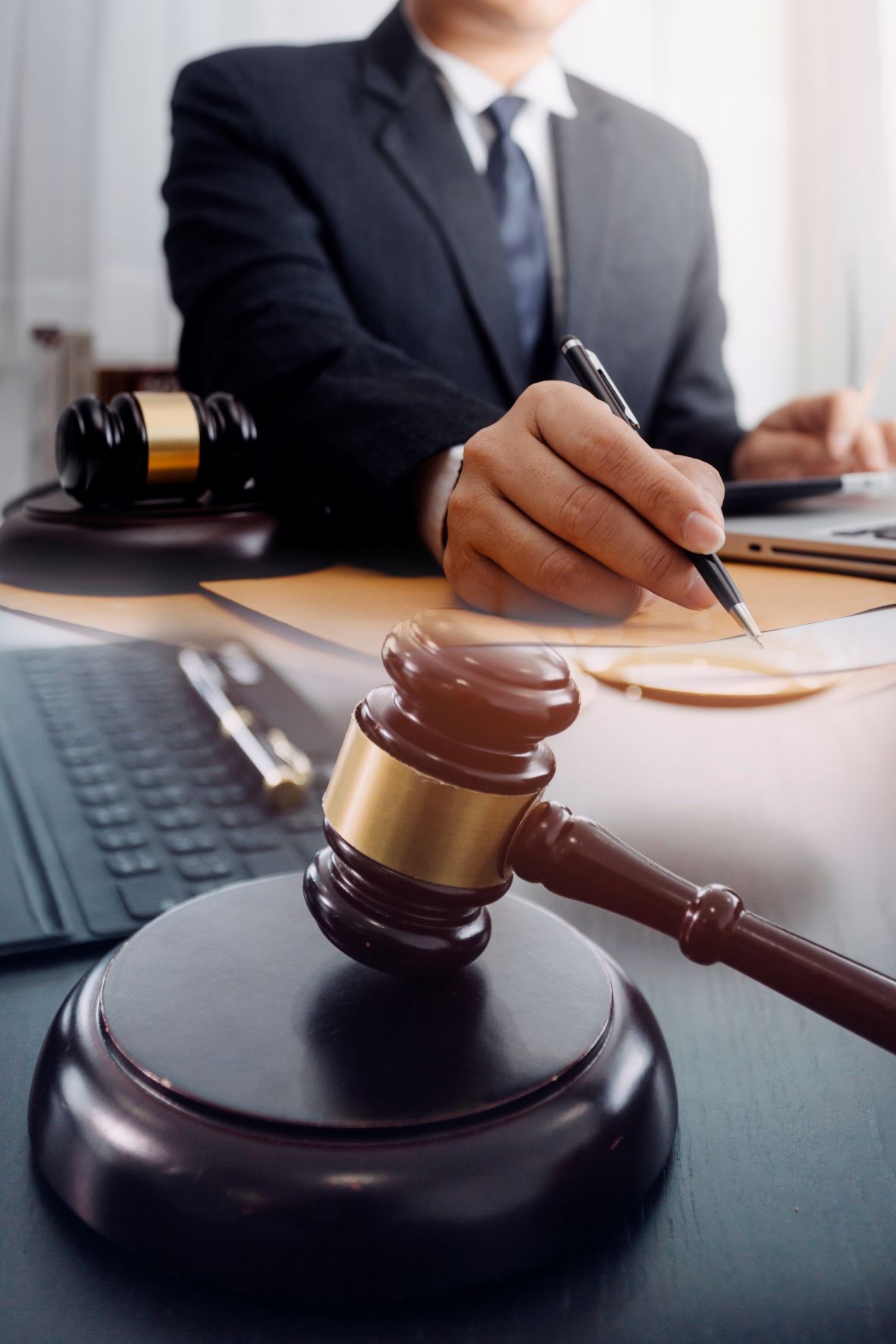 A lawyer signs a document